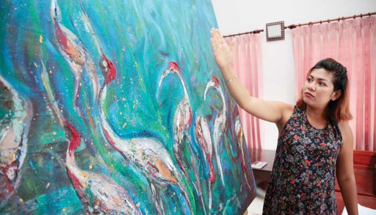 Cambodian Artists Khmer Female Artist Dina Chhan Painter and Sculptor in her studio in Phnom Penh